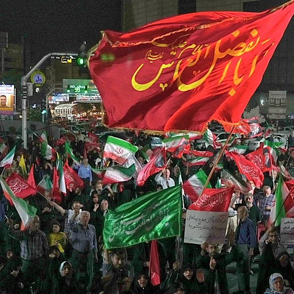 Iran says it is suspending commitments to interim deal with US as they exchange attacks
