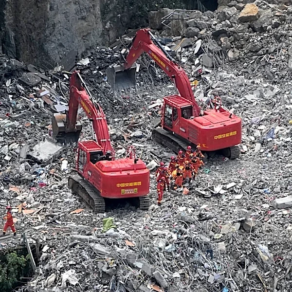 Rescuers in China search the rubble for survivors of landslide that killed 8 and left 34 missing
