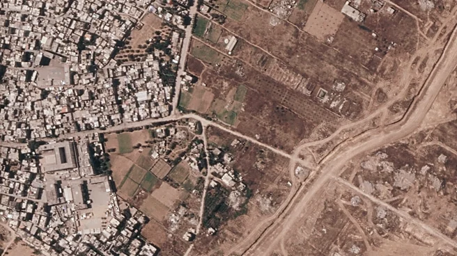 Israel is building a miles-long earthen barrier inside Gaza, entrenching its division
