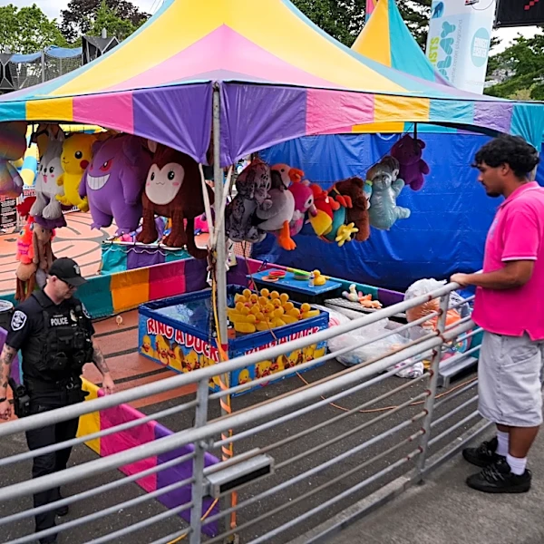 Police arrest 1 person and search for another after Seattle festival shooting that killed 3