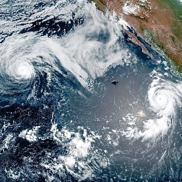 Major hurricane Genevieve roars in the Pacific as Fausto weakens to a tropical storm near Hawaii