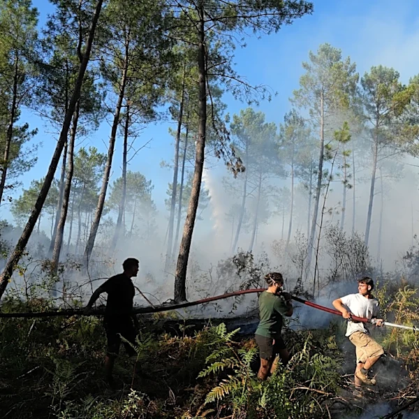 Firefighters in France hold back vast wildfire as heat returns to test their grip