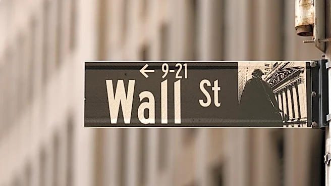 Most of Wall Street rises as oil prices ease, even as chip stocks keep dropping
