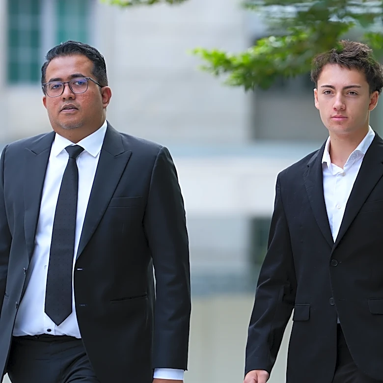 French student pleads guilty and is fined for a straw-licking stunt in Singapore