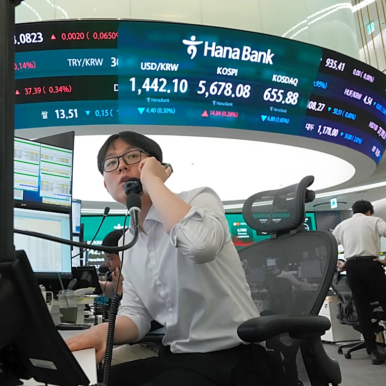 Oil prices slip and Asian shares are mostly lower as investors sell chipmaker stocks