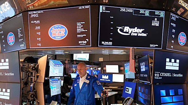 US stocks swing as Amazon leaps, Apple sinks and rising oil prices add to worries about inflation