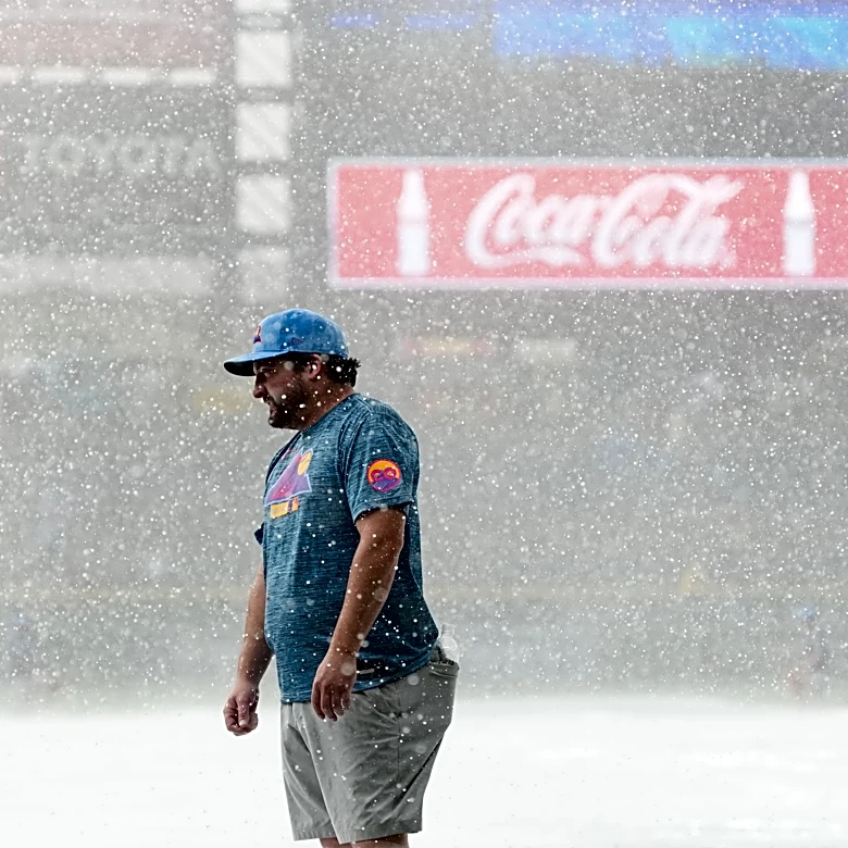 Sugano helps the Rockies beat the Royals 3-1 in game delayed at start by hailstorm