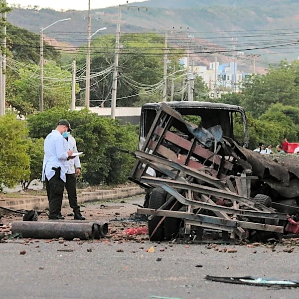 Truck explodes outside Colombia police base, injuring 11 officers and killing a dog