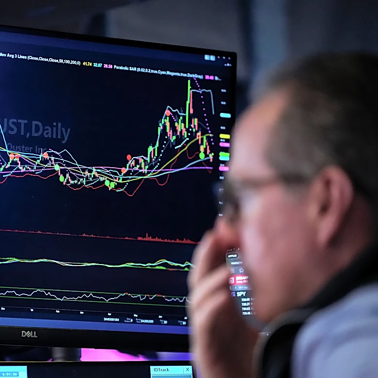 Falling oil prices help calm Wall Street's inflation worries, while chip stocks get back to sinking