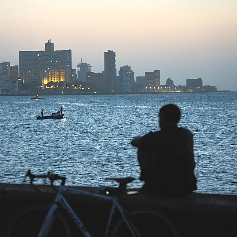 Cubans sleep on seaside boardwalk to seek relief from crippling blackouts and summer heat