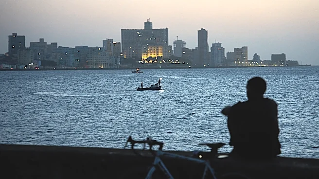 Cubans sleep on seaside boardwalk to seek relief from crippling blackouts and summer heat