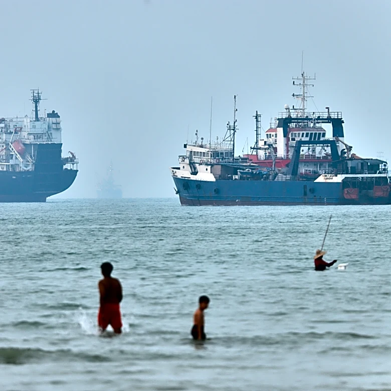 Cargo ship reports being struck in Strait of Hormuz as US, Iran claims about talks diverge
