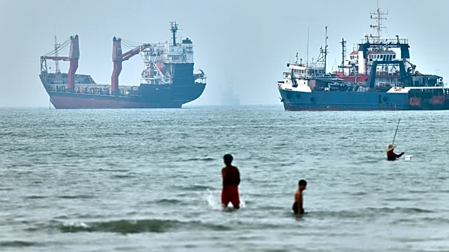 Cargo ship reports being struck in Strait of Hormuz as US, Iran claims about talks diverge