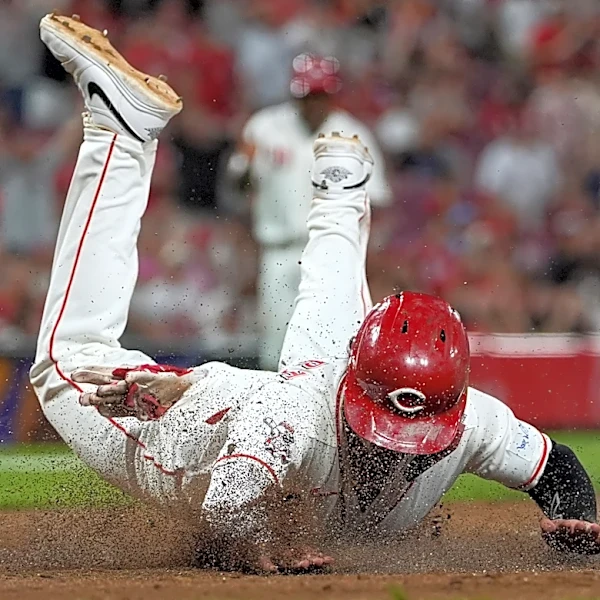 Reds score twice in 8th on wild pitches to beat Athletics 5-4