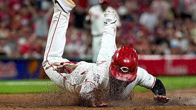 Reds score twice in 8th on wild pitches to beat Athletics 5-4