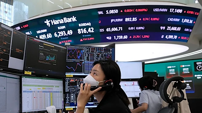 Asian shares are mixed after gains on Wall Street, while oil prices climb
