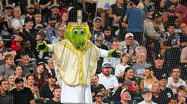 Reds rally late, beat the White Sox 5-4 in the 10th to spoil pope hat giveaway night