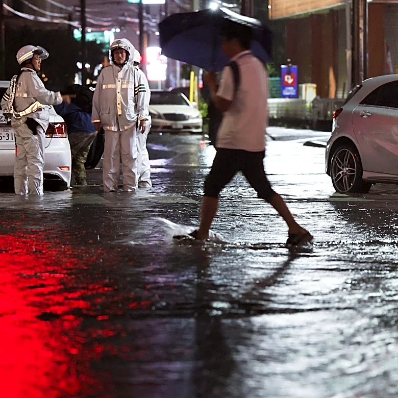 Torrential rain near Tokyo causes flooding and paralyzes traffic, killing 1