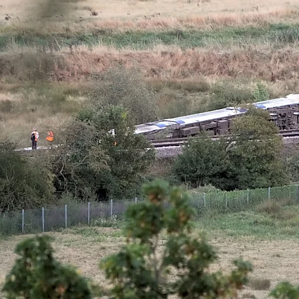 Passenger train derails and 11 people injured after carriages overturn in southern England