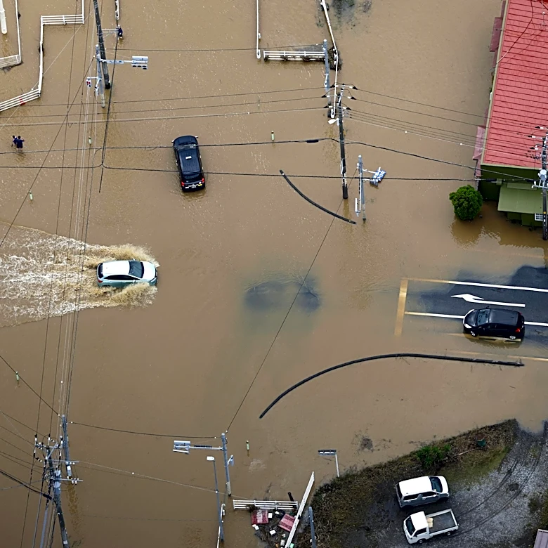 Heavy rain causes flooding near Tokyo that kills 4 and strands travelers