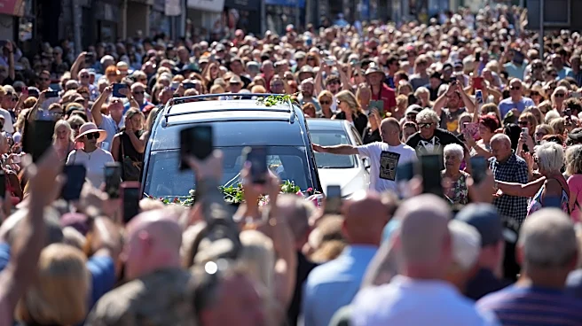 Bonnie Tyler fans line the streets of a Welsh village as her coffin is brought home