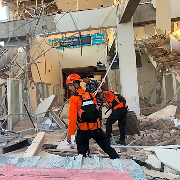 Rescuers dig through rubble and landslides after Indonesia quake kills 53