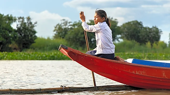 Photos show Cambodian children attend school in floating villages along the Tonle Sap lake.