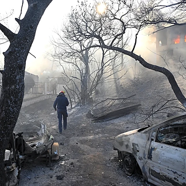 Belgian wildfire approaches Germany despite rain as Greece probes deadly blaze