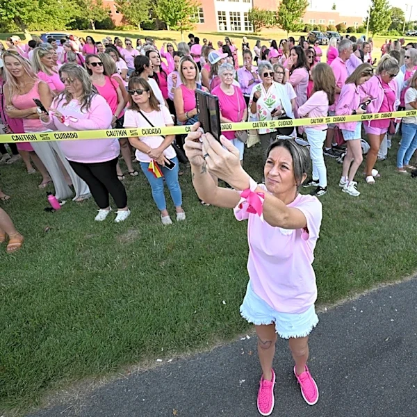 Women in pink rally in support of Lindsay Clancy who is on trial for killing 3 children