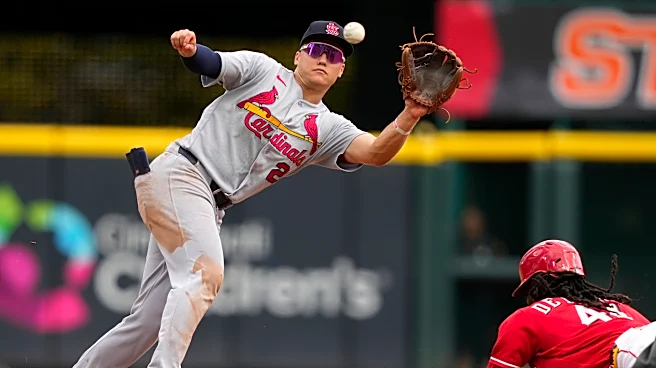 Dane Myers' dropped fly with 2 outs in 9th gives Cardinals a wild 10-9 win over Reds