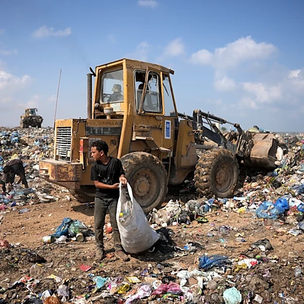 Palestinians in Gaza scavenge trash for things to burn to cook meals, in photos