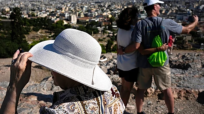 The sunhat is everywhere in Athens as crowds grow larger at ancient sites
