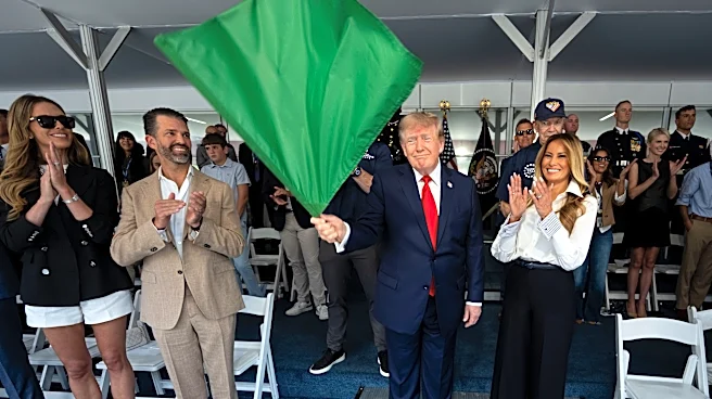 Trump waves the green flag to start the IndyCar race as drivers zoom through Washington's streets