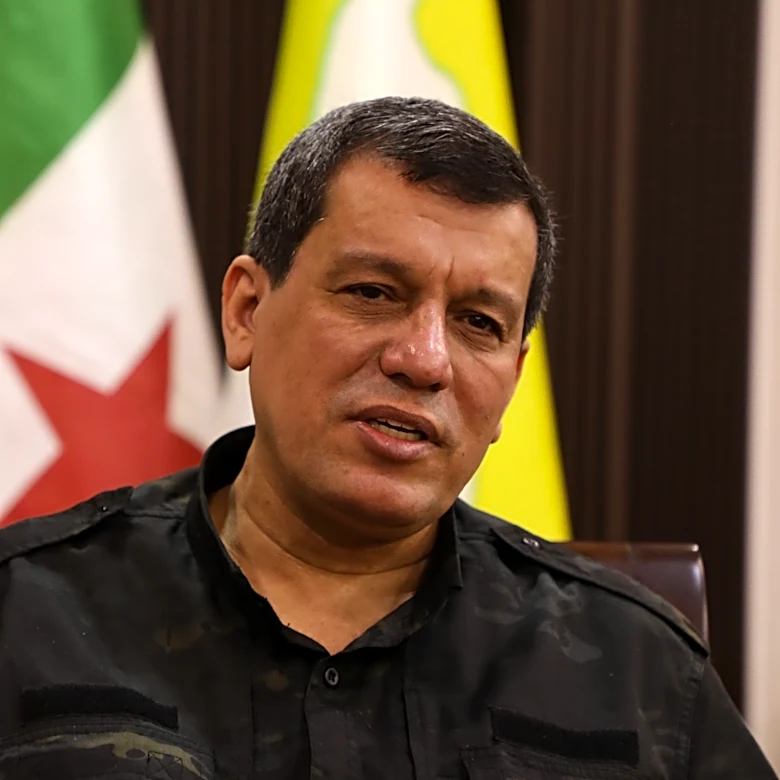 Kurdish-led group in Syria says it has dissolved after merging with the army