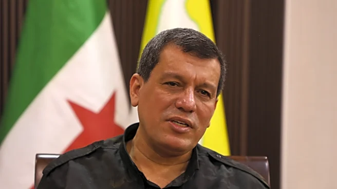 Kurdish-led group in Syria says it has dissolved after merging with the army