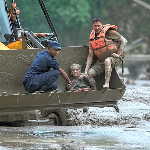 Floods caused by a glacial collapse kill at least 160 people on Nepal-China border, hundreds missing