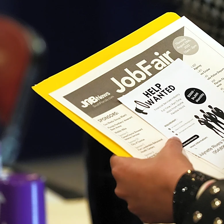 The number of Americans applying for jobless aid slips to 203,000 as layoffs remain low