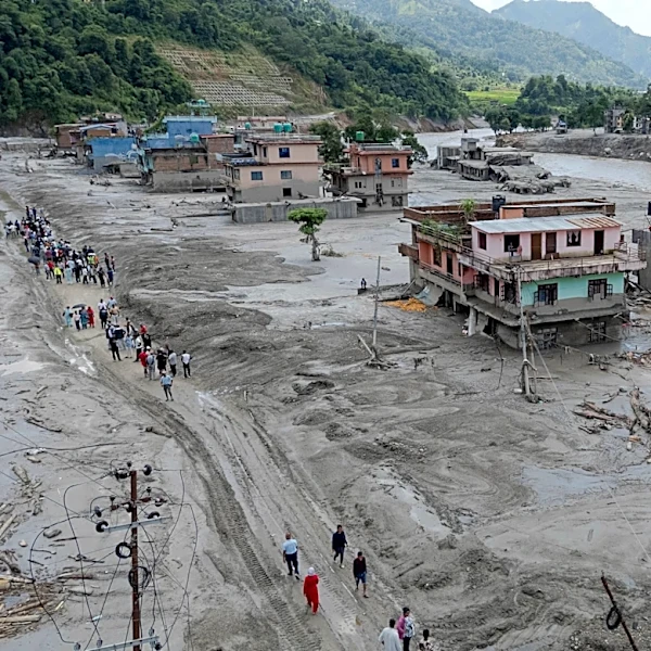 Death toll from flash floods rises with rescuers in Nepal and China working to find hundreds missing