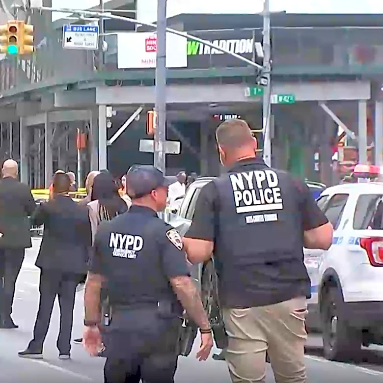 A woman brandishing two knives is shot by police in Times Square