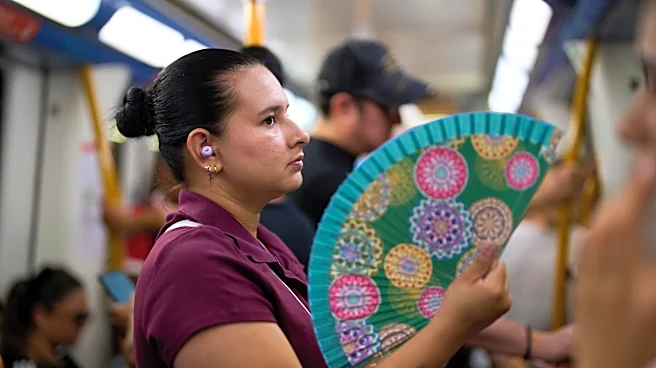 In a scorching Spain, the traditional folding hand fan is having a moment