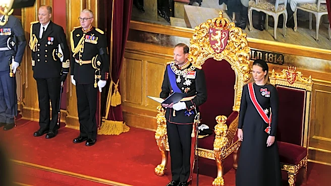 King Haakon VIII pledges an oath of allegiance to Norway's constitution as his father lies in state