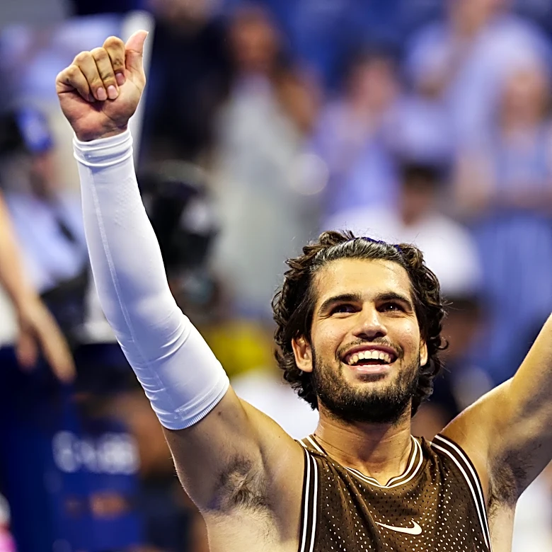 Carlos Alcaraz recovers after dropping the first set to reach the second round at the US Open