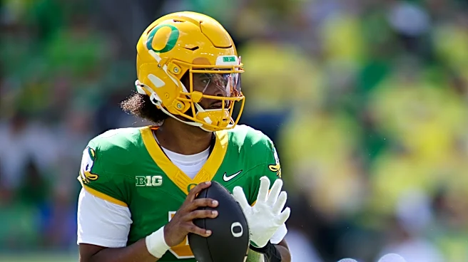 Moore throws for 3 TDs and No. 2 Oregon overcomes a slow start to beat Boise State 34-27