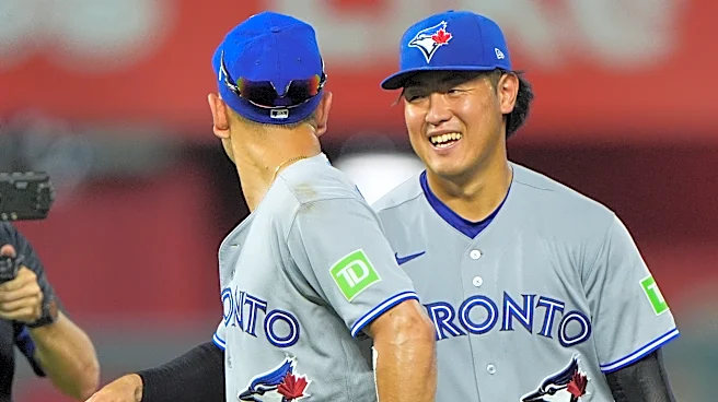 Kazuma Okamoto leads Blue Jays past Royals 4-3 to pull into tie for last AL wild card