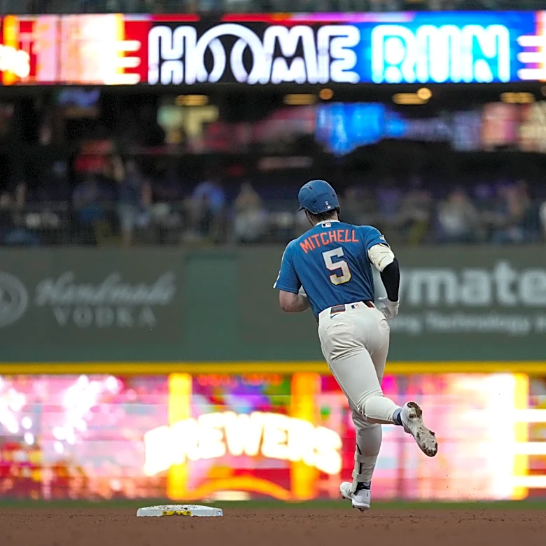Garrett Mitchell hits grand slam and MLB-best Brewers pound Reds 20-0 to clinch playoff spot