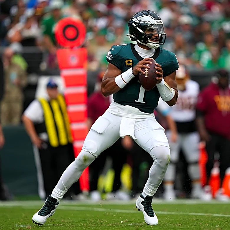 Jalen Hurts throws 3 TD passes and Eagles stuff Commanders' late 2-point try for 24-22 win