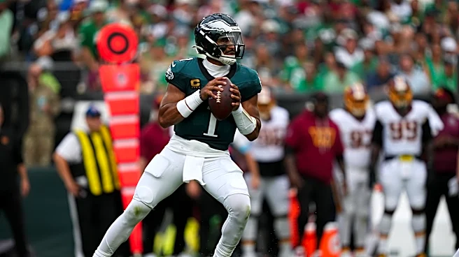 Jalen Hurts throws 3 TD passes and Eagles stuff Commanders' late 2-point try for 24-22 win