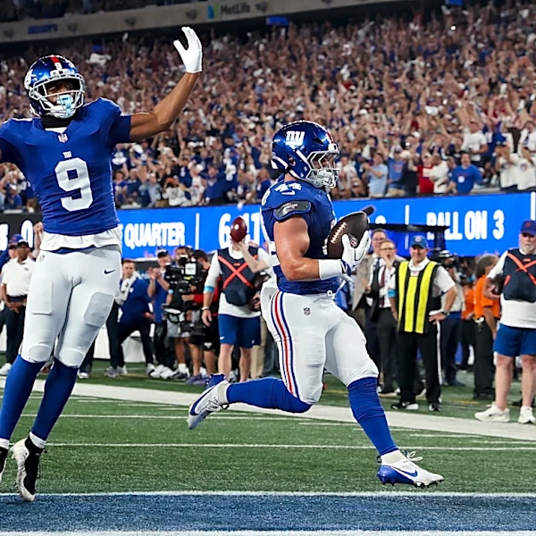 Giants' offense rolls over the Cowboys to give coach John Harbaugh a 28-20 win in his debut