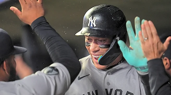 Judge's first homer since May 24 helps clinch postseason berth for Yankees in 8-3 win at Twins