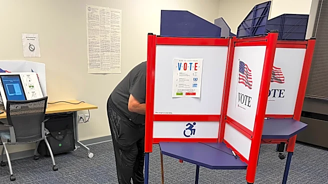 The Latest: Early midterm voting gets underway with control of Congress at stake